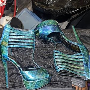 Brand new. Blue iridescent high high heels!!